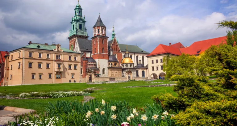 Poland Krakow Wawel Castle Blooming Park Domes Cathedral Against Cloudy Sky
