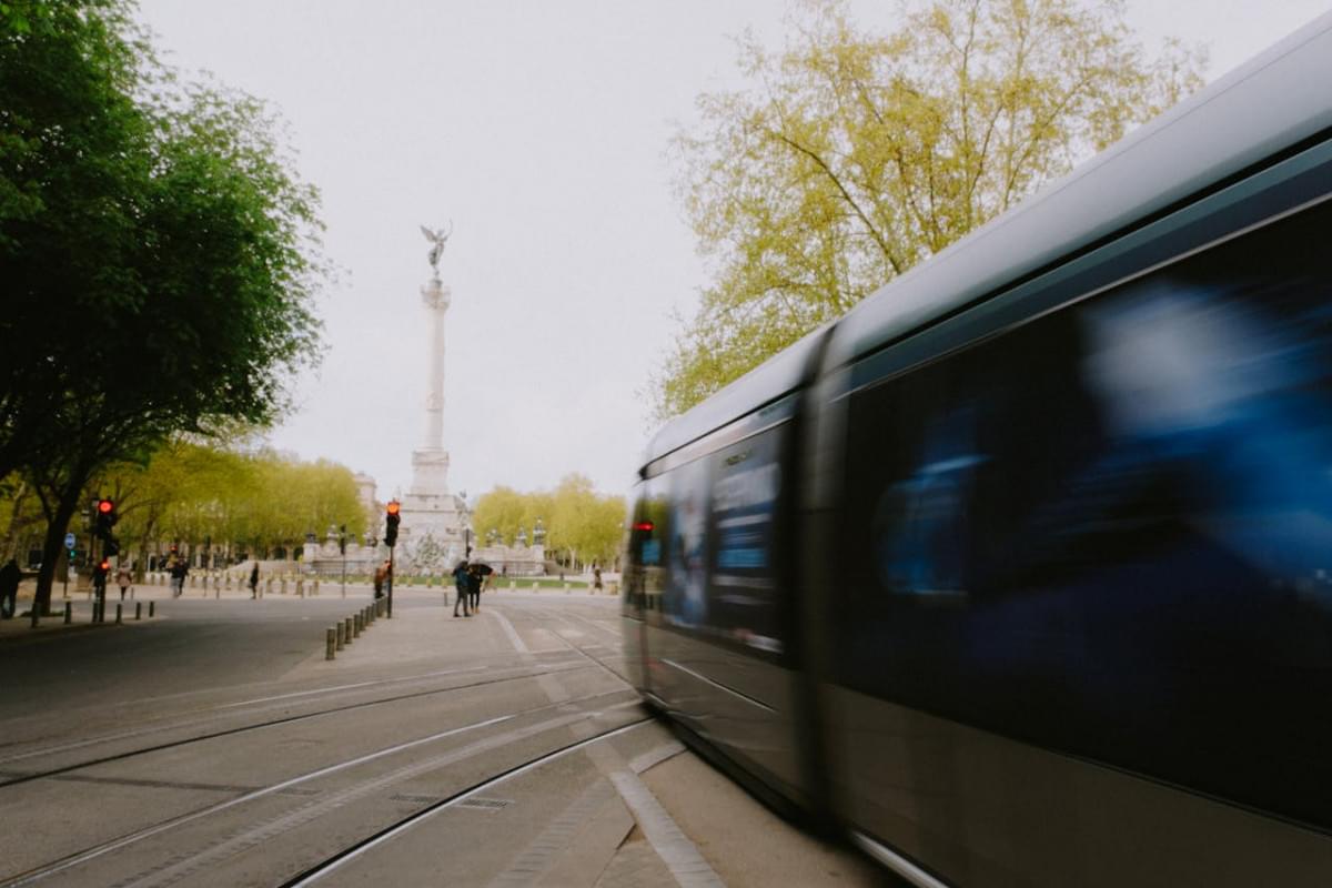 the girondins monument and blurred tram bordeaux france