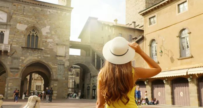 Beautiful Girl With Hat Visiting Piazza Vecchia Square Bergamo Citta Alta Medieval Old City Lombardy Region Italy