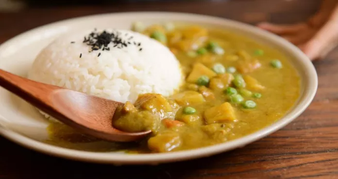 Cooked Rice And Curry Food Served On White Plate