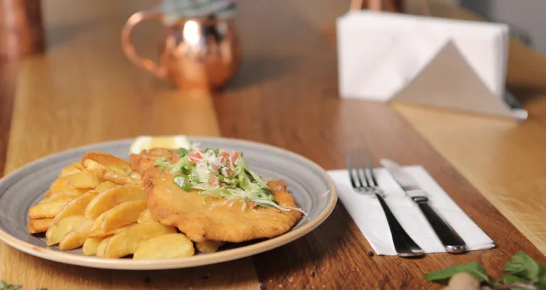 Delicious Schnitzel Served With French Fries