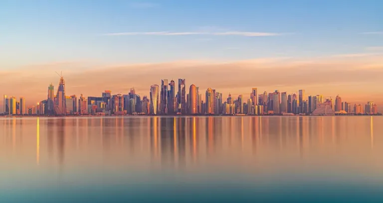 Scenic Cityscape Of Modern Coastal Megapolis Under Sunset Sky