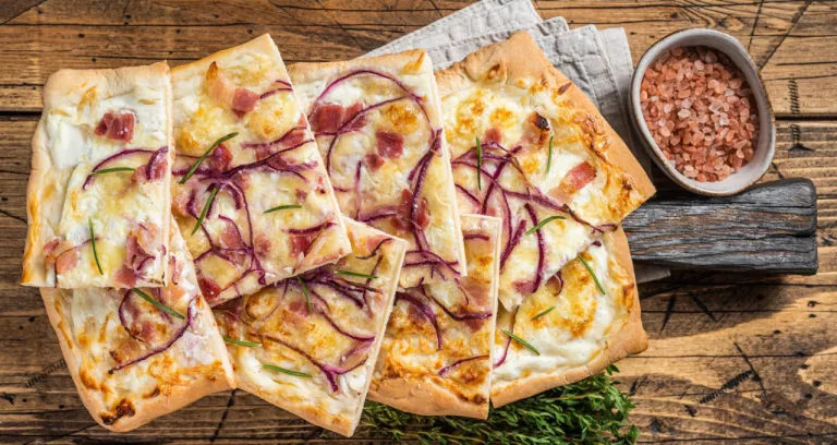 Flammkuchen Or Tarte Flambee With Cream Cheese Bacon And Onions Wooden Background Top View
