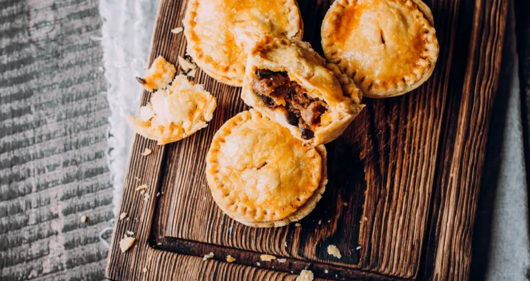 Fresh Traditional Australian Meat Mini Pie Wooden Board Table Closeup With Copy Space Rustic Style