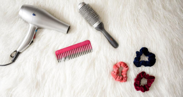 Grey Hair Blower Near Pink Hair Combs And Scrunchies