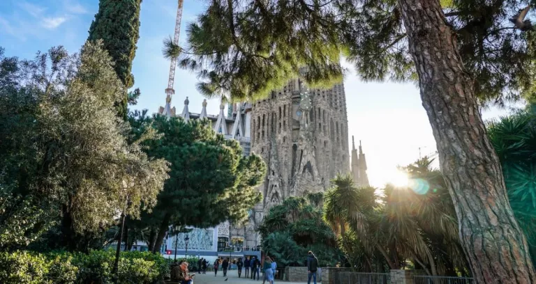 Group Of People Walking In Front Of Sagrada Familia Cathedral