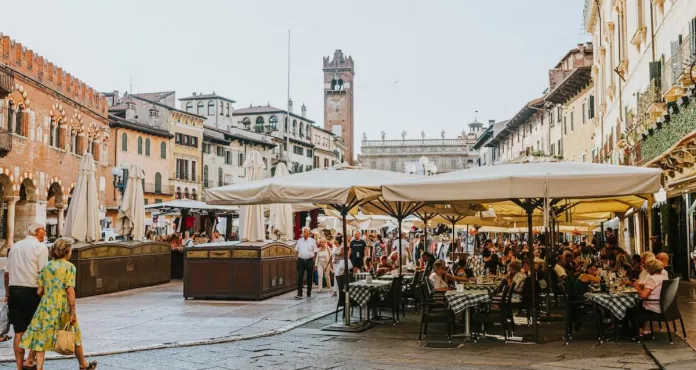 People Dining Al Fresco At Piazza Delle Erbe