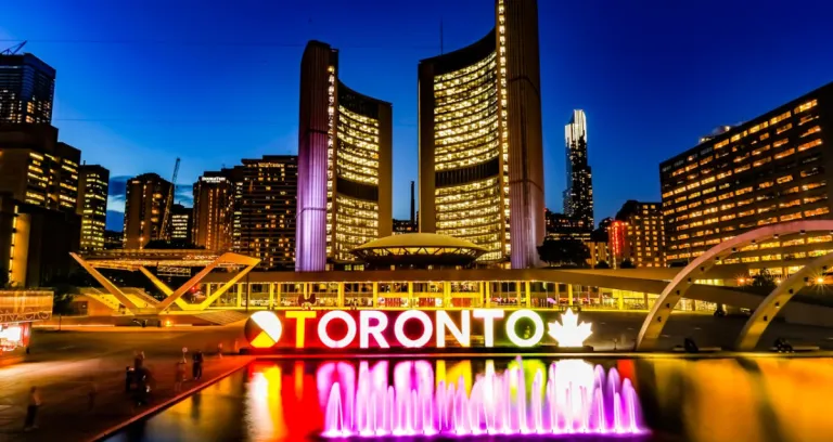 Powered On Toronto Neon Sign Near Water Fountain