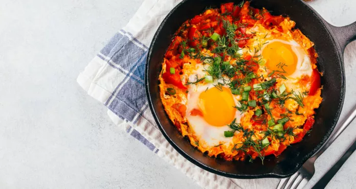 Traditional Israel Dish Eggs With Tomatoes Dish Shakshouka Pan Light Table Top View Copy Space