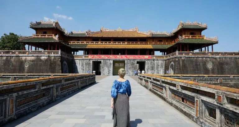 Unrecognizable Woman Walking Near Meridian Gate In Vietnam