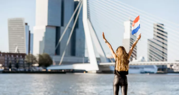 Woman With Dutch Flag Enjoying Beautiful Cityscape View Modern Riverside During Morning Rotterdam City