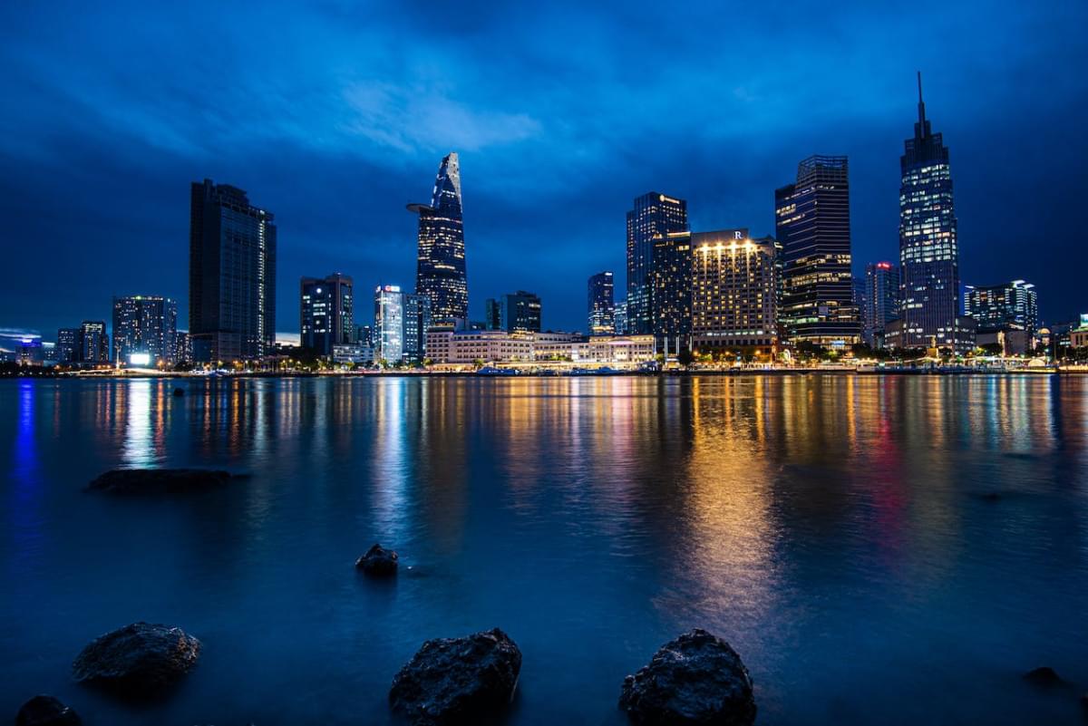 a city buildings near the saigon river at night