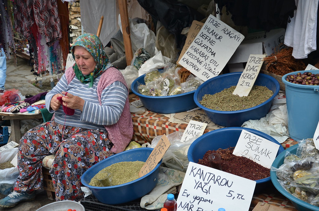 a local does a spot of knitting to pass the time