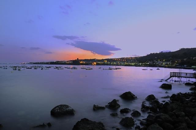 acitrezza tramonto sui faraglioni