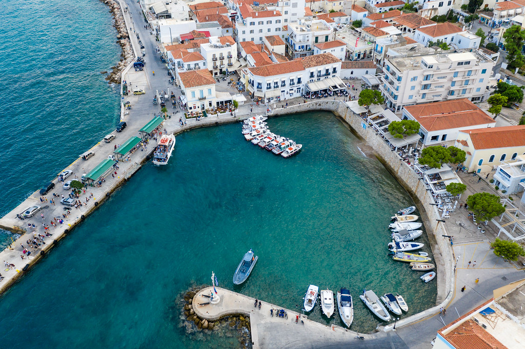 aerial view of a small bay and busy streets at spetses greece with water taxis for island hopping