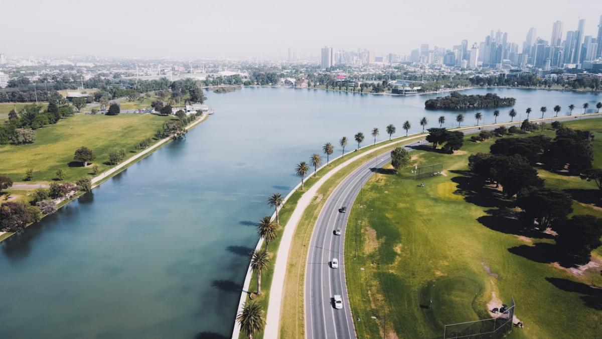 aerial view of highway near body of water