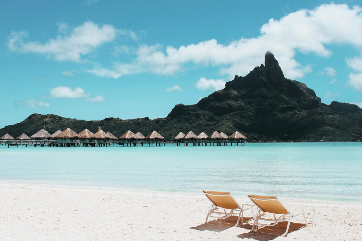 an island with cottages and beach chairs 1