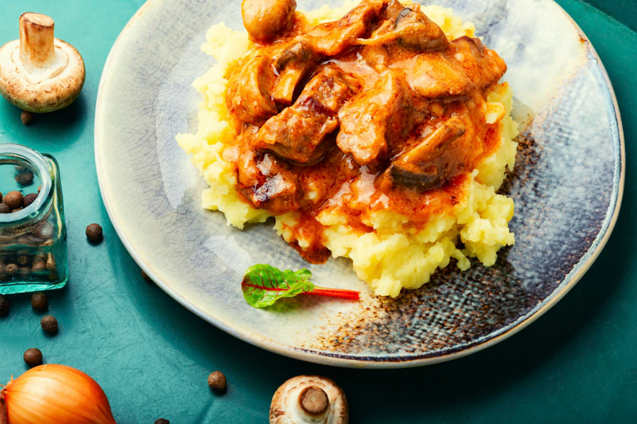 appetizing beef stroganoff meat meat with mushrooms mashed potatoes