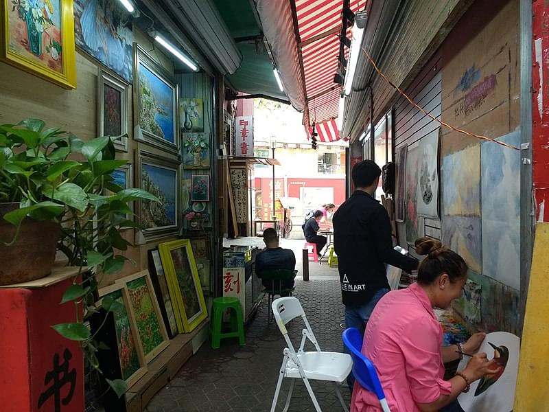 artists at work in dafen oil painting village