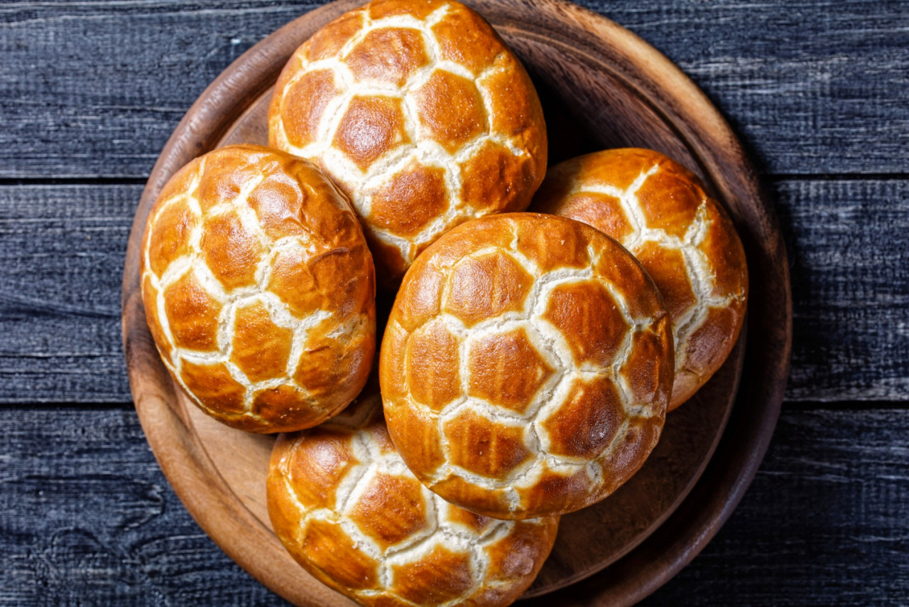 asian cuisine chinese pineapple buns soft fluffy milk buns served round cutting board dark wooden background top view close up