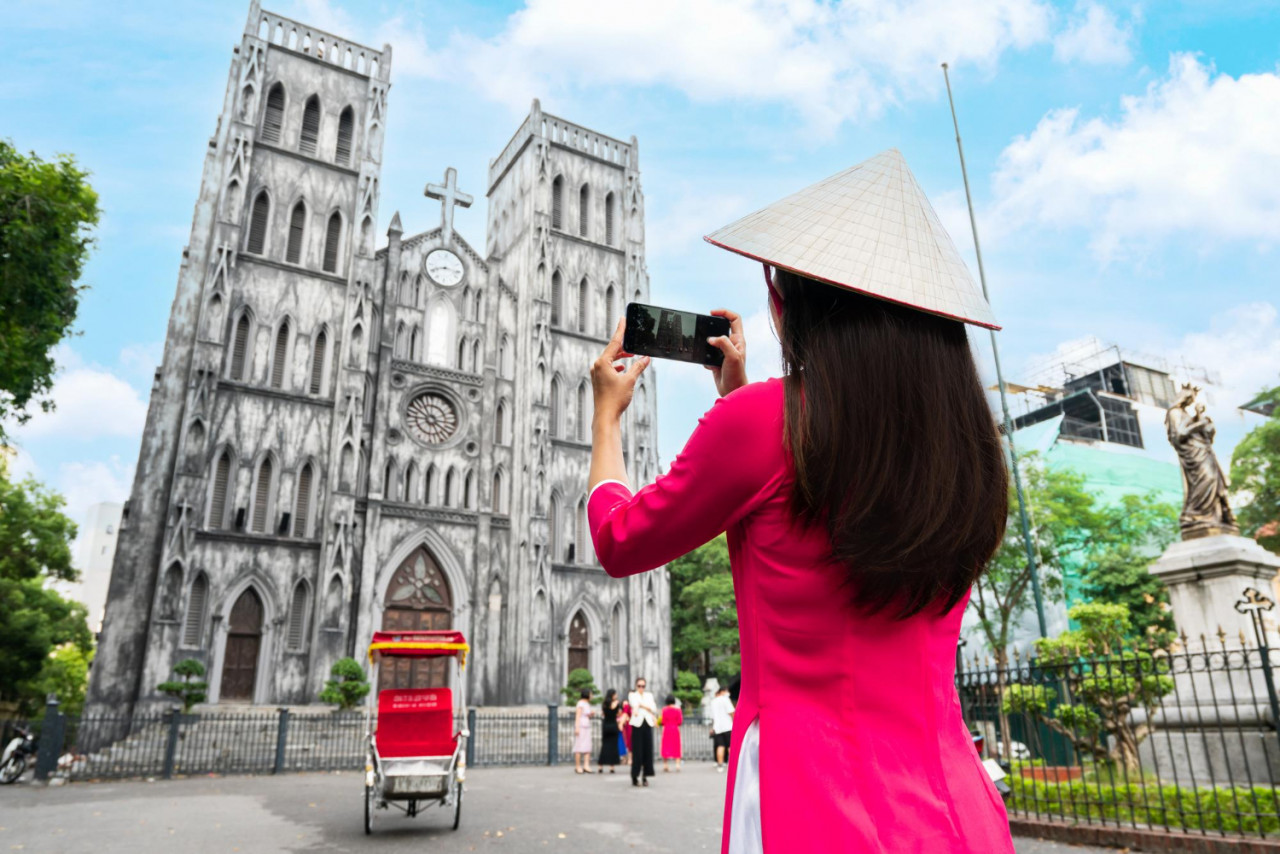 asian woman tourist ao dai traditional vietnamese dress sightseeing st joseph s cathedra