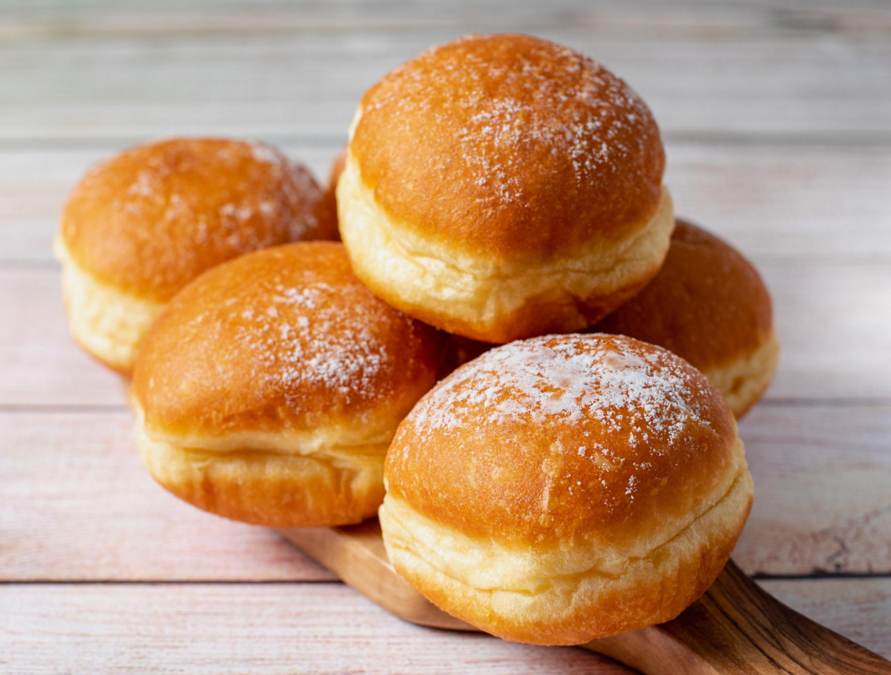 austrian german donuts krapfen faschingskrapfen berliner with cream wooden background