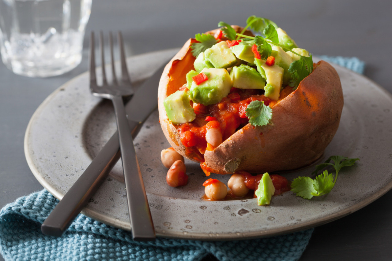 baked sweet potatoes with avocado chili salsa beans