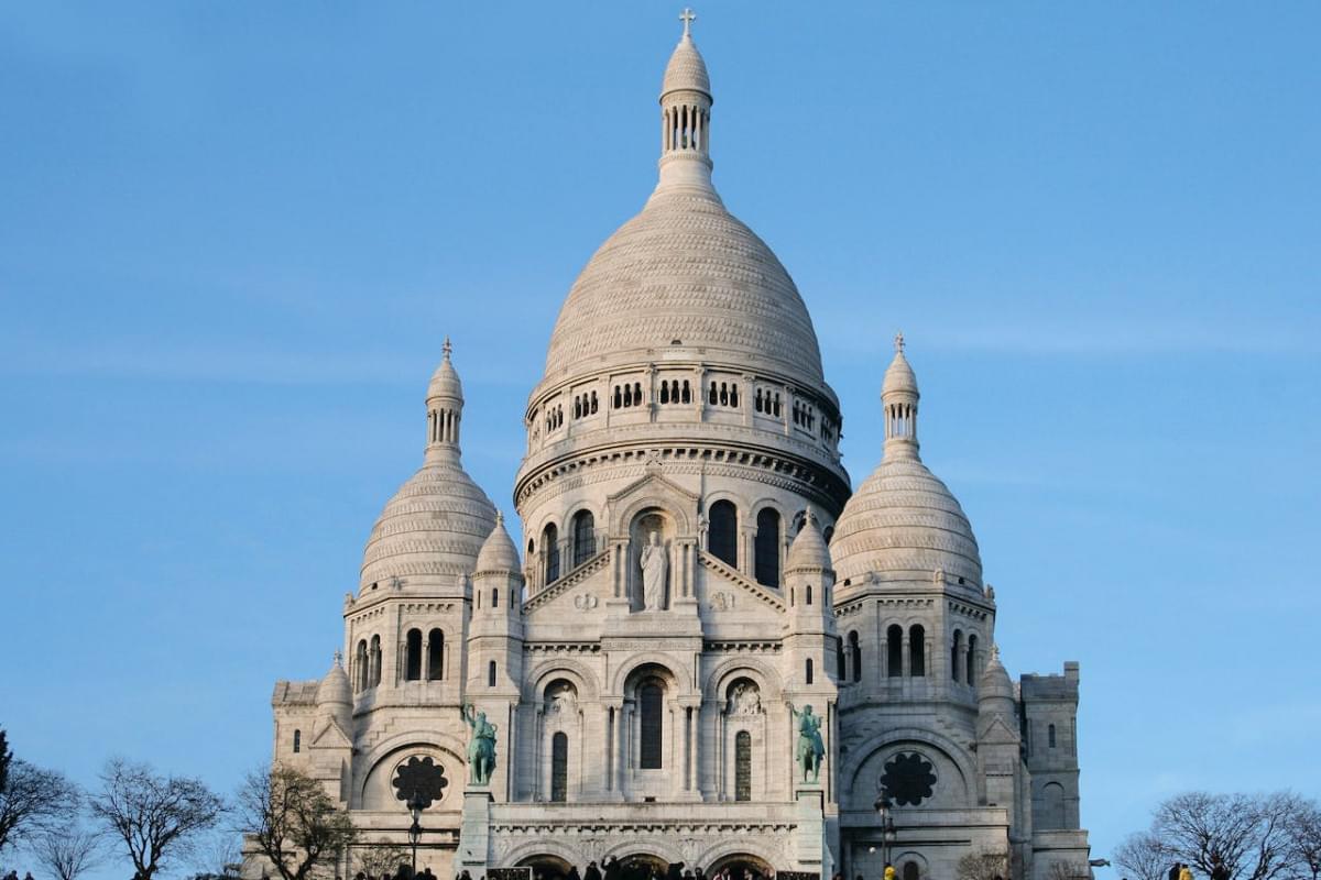 basilica of the sacred heart of jesus under blue sky