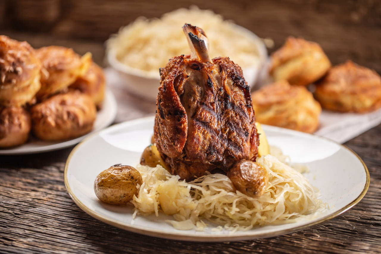 bavarian pork knuckle with sauerkraut baked potatoes