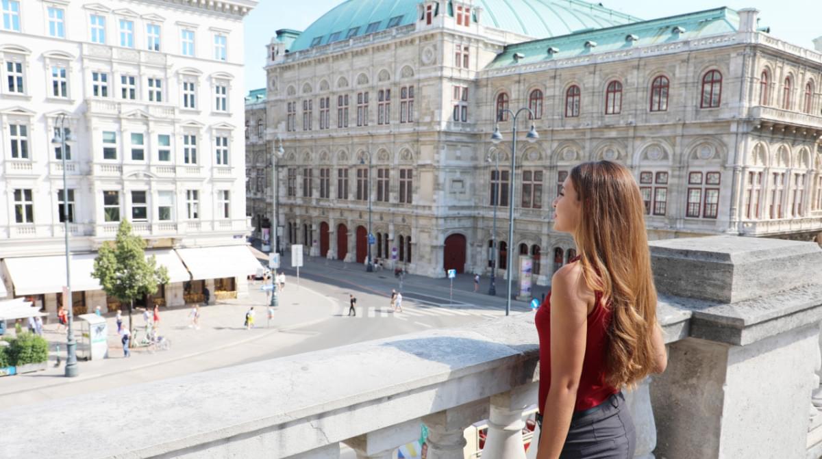 beautiful girl enjoying visiting city vienna with famous historic palaces state opera hotel sacher