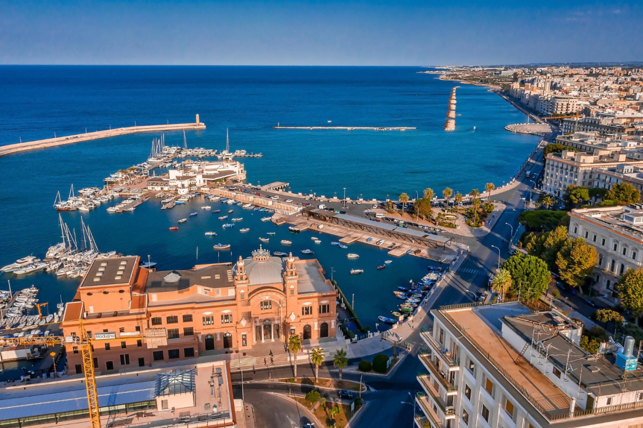 beautiful panoramic aerial view photo from flying drone sunset bari apulia city port boats yachts sea coastline teatro margherita bari city skyline bari apulia italy series