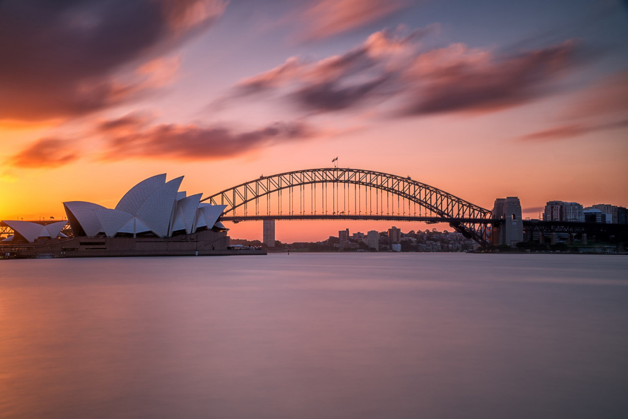 beautiful shot sydney harbor bridge with light pink blue sky