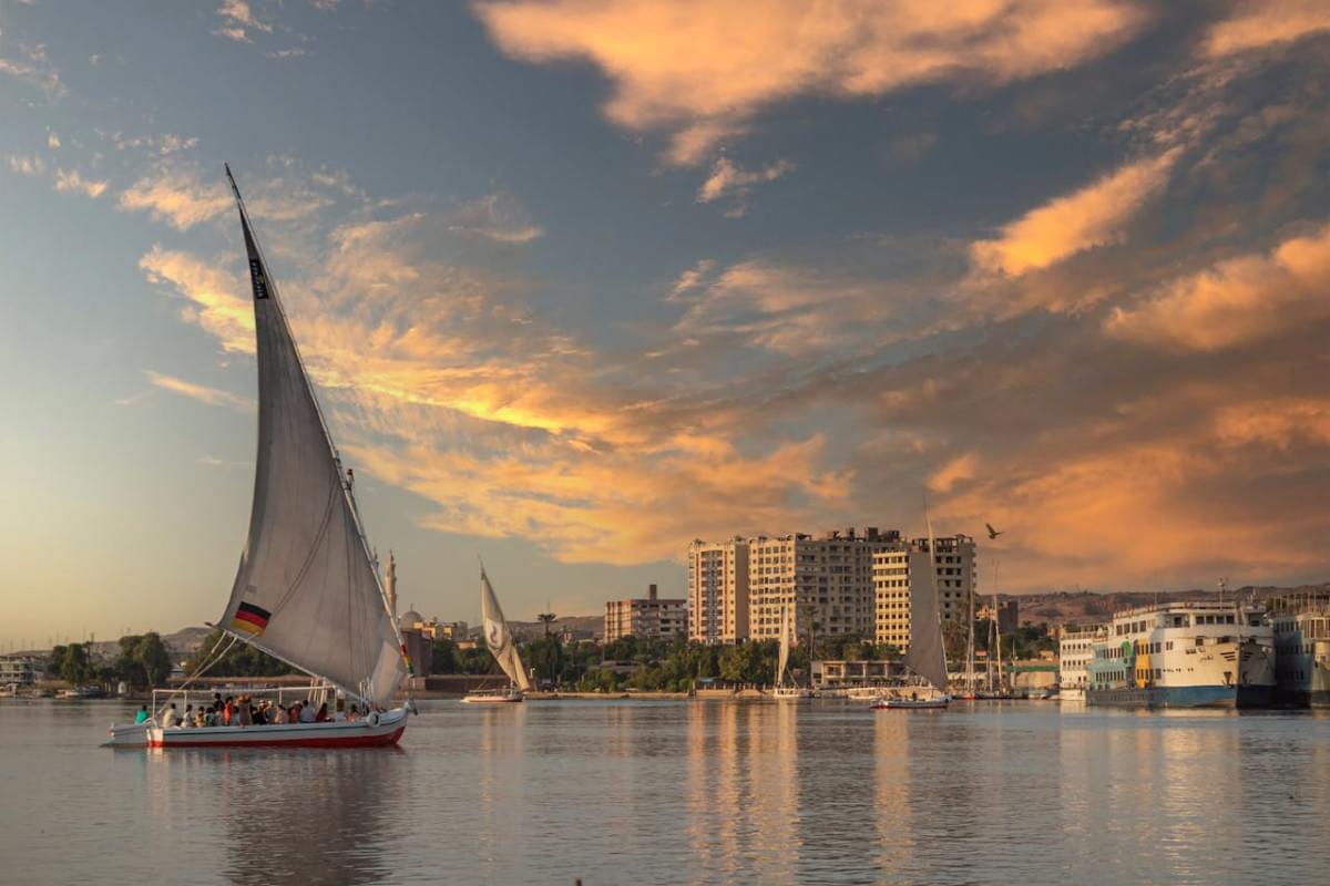 boats in harbor at sunset