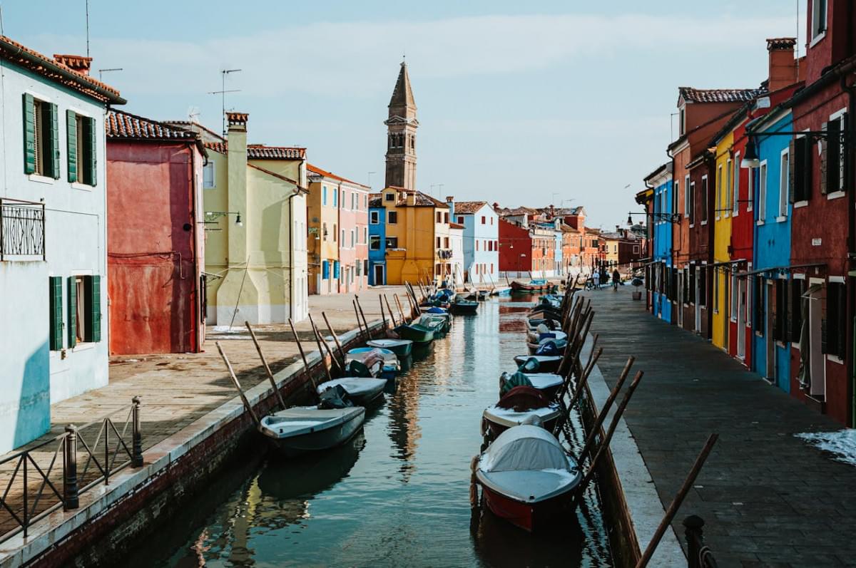 boats on dock near buildings