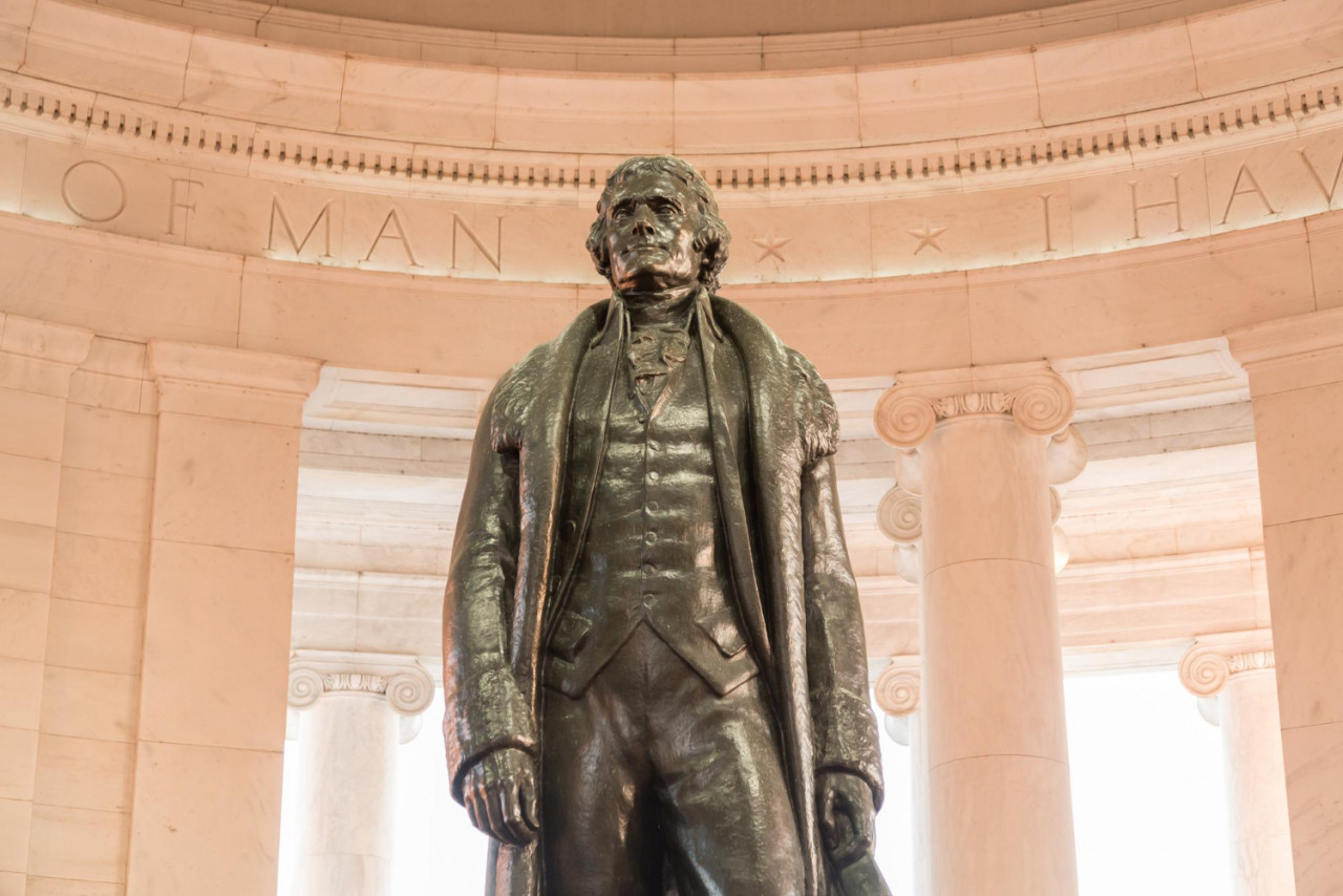 bronze statue thomas jefferson jefferson memorial washington dc as setting sun illuminates interior monument