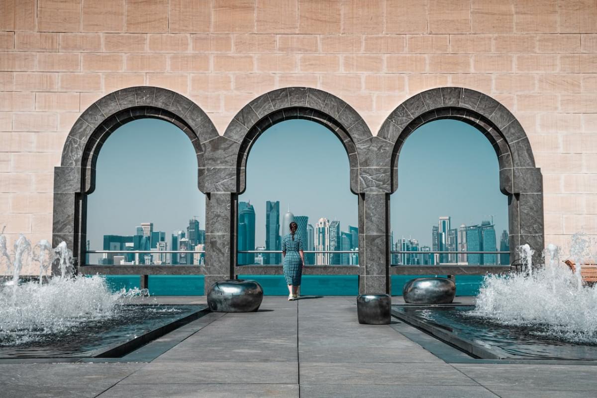 brown building with stonewall and arches