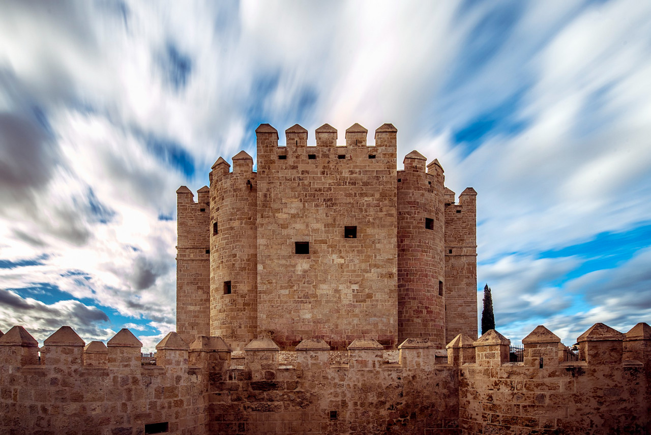 calahorra tower cordoba with clouds blue sky