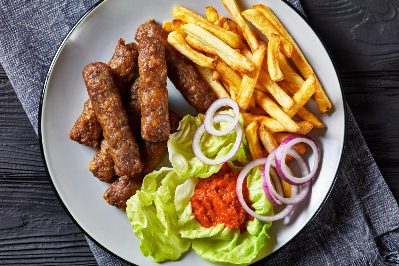 cevapcici with potato fries lettuce onion ajvar 1