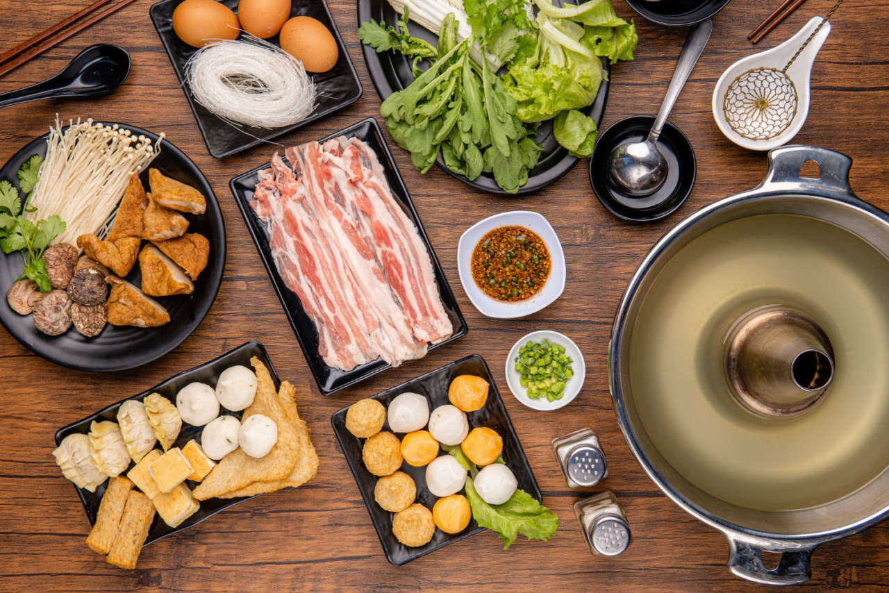 chinese hot pot also known as soupfood steamboat is cooking method that originates from china prepared with simmering pot soup stock dining table