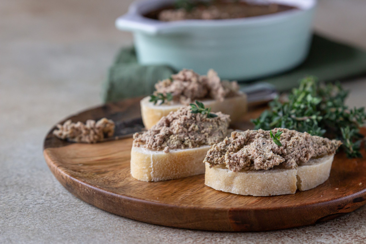 ciabatta with chicken turkey liver pate with thyme concrete background