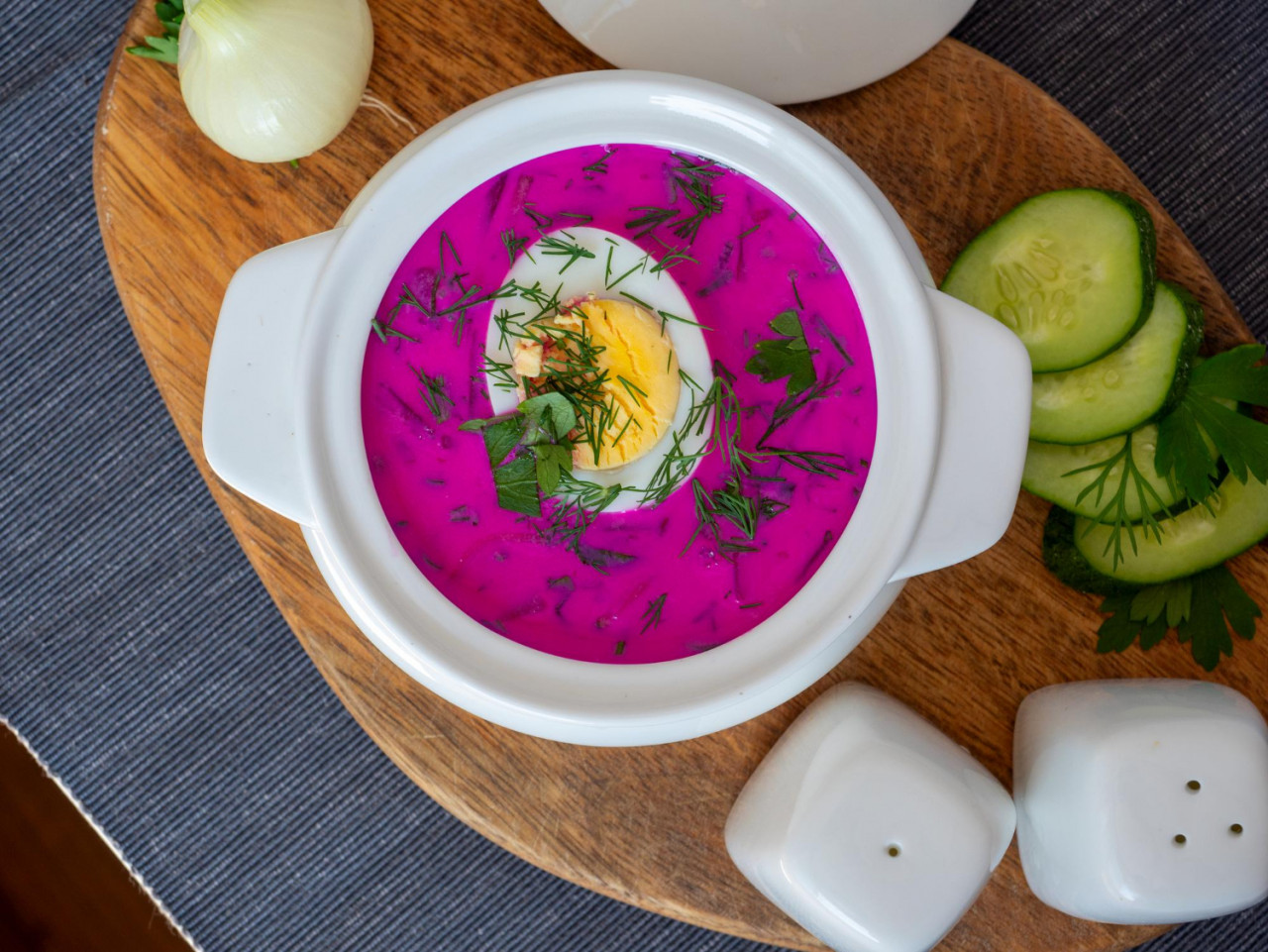 close up cold chlodnik soup wooden board soup polish belarusian russian cuisine made beetroot kefir decorated with half egg healthy food top view flat lay