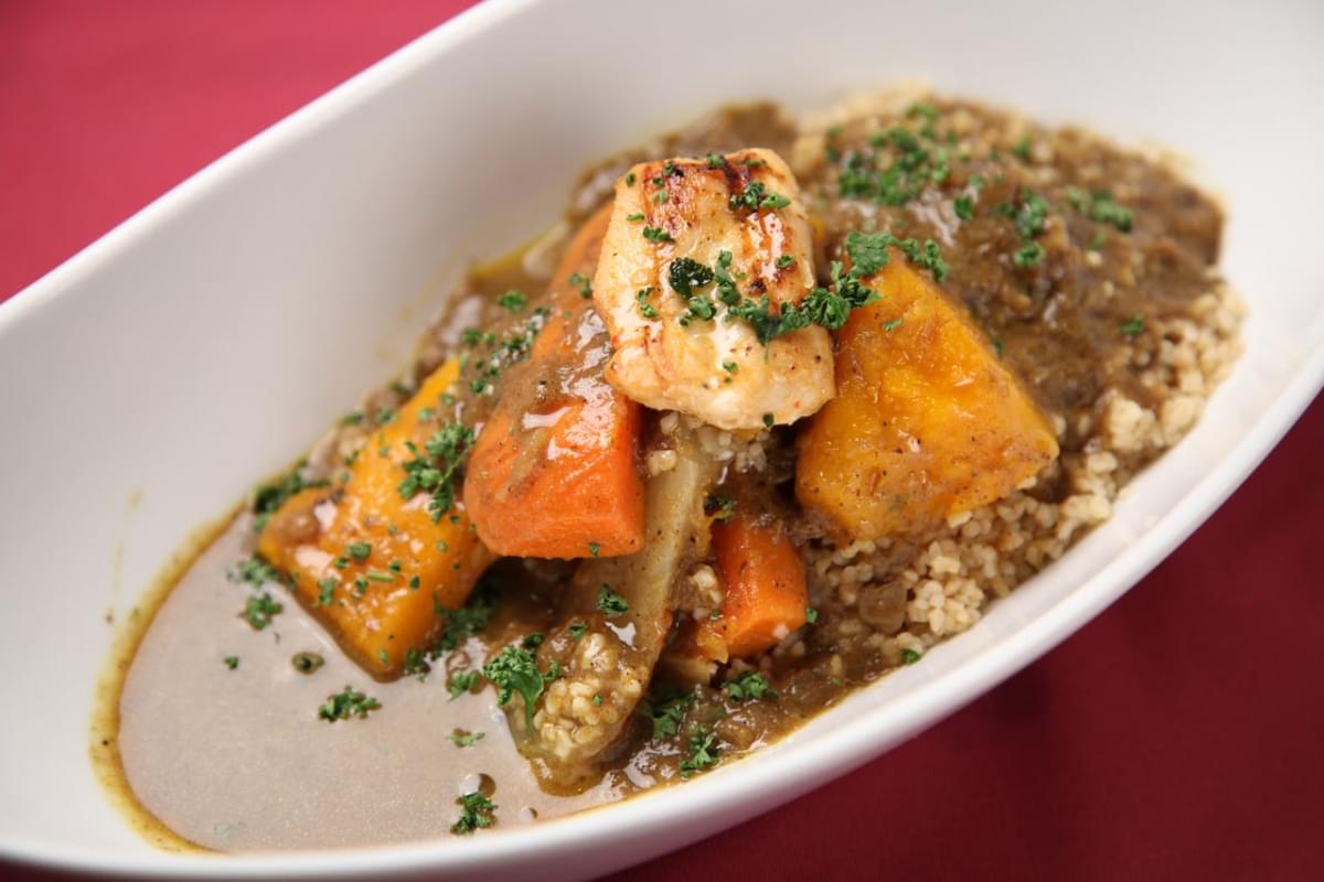 close up photo of meat stew on white ceramic bowl