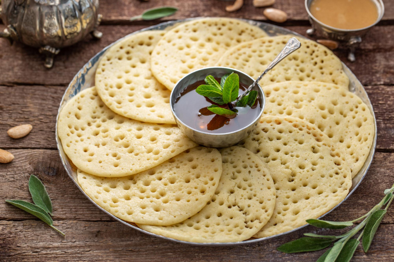 close view morrocan pancakes baghrir with honey