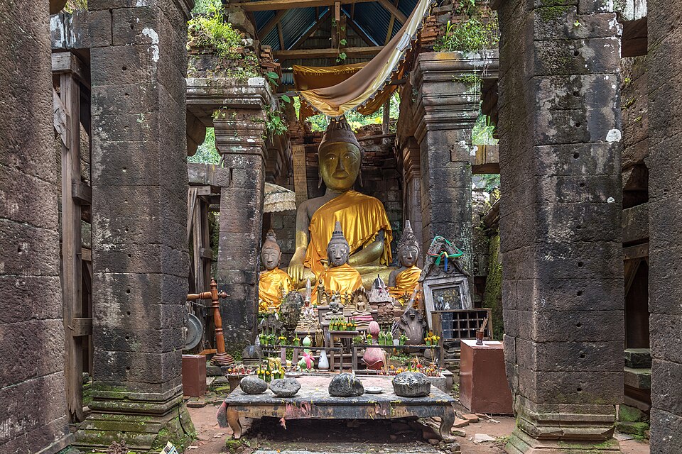 clothed statues of the buddha in the ruined khmer hindu temple of wat phou champasak laos