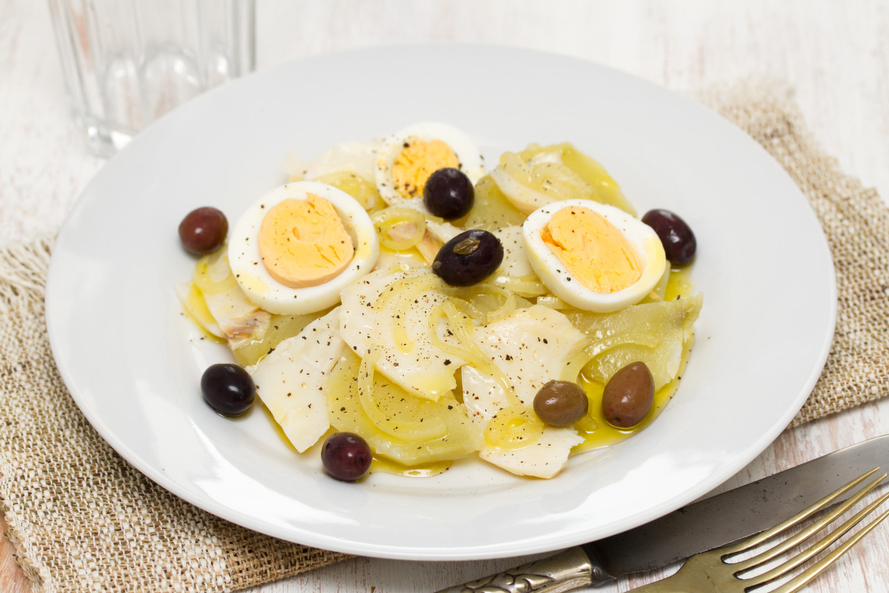 cod fish with potato egg olives plate