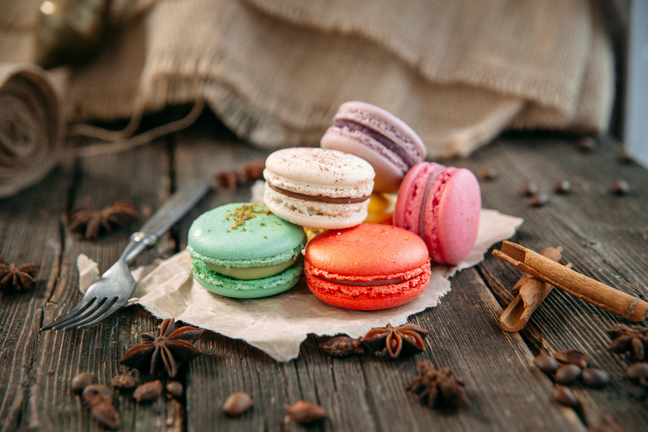 coloured sweet macaron dessert wooden table