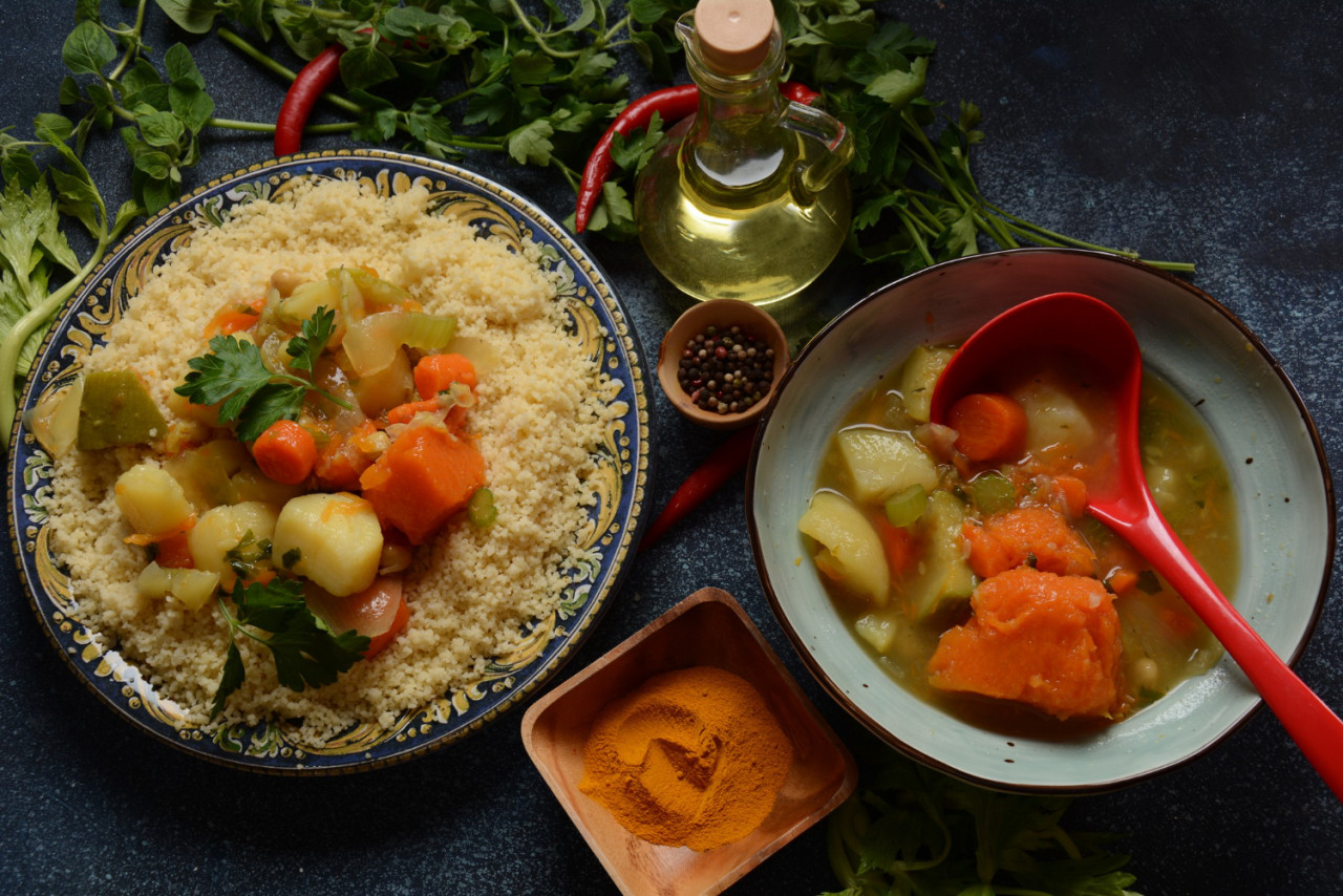 cooked couscous with green parsley ceramic plate vegetable stew