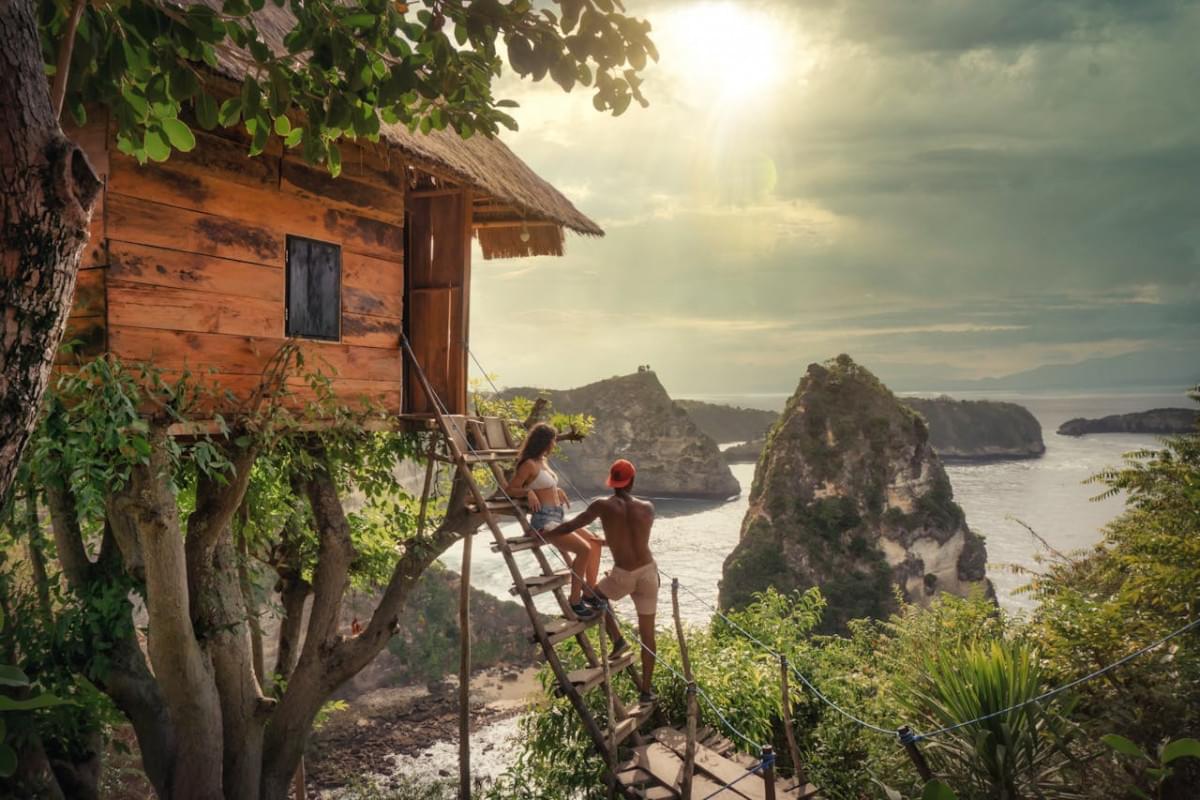 couple sitting on brown wooden ladder 1