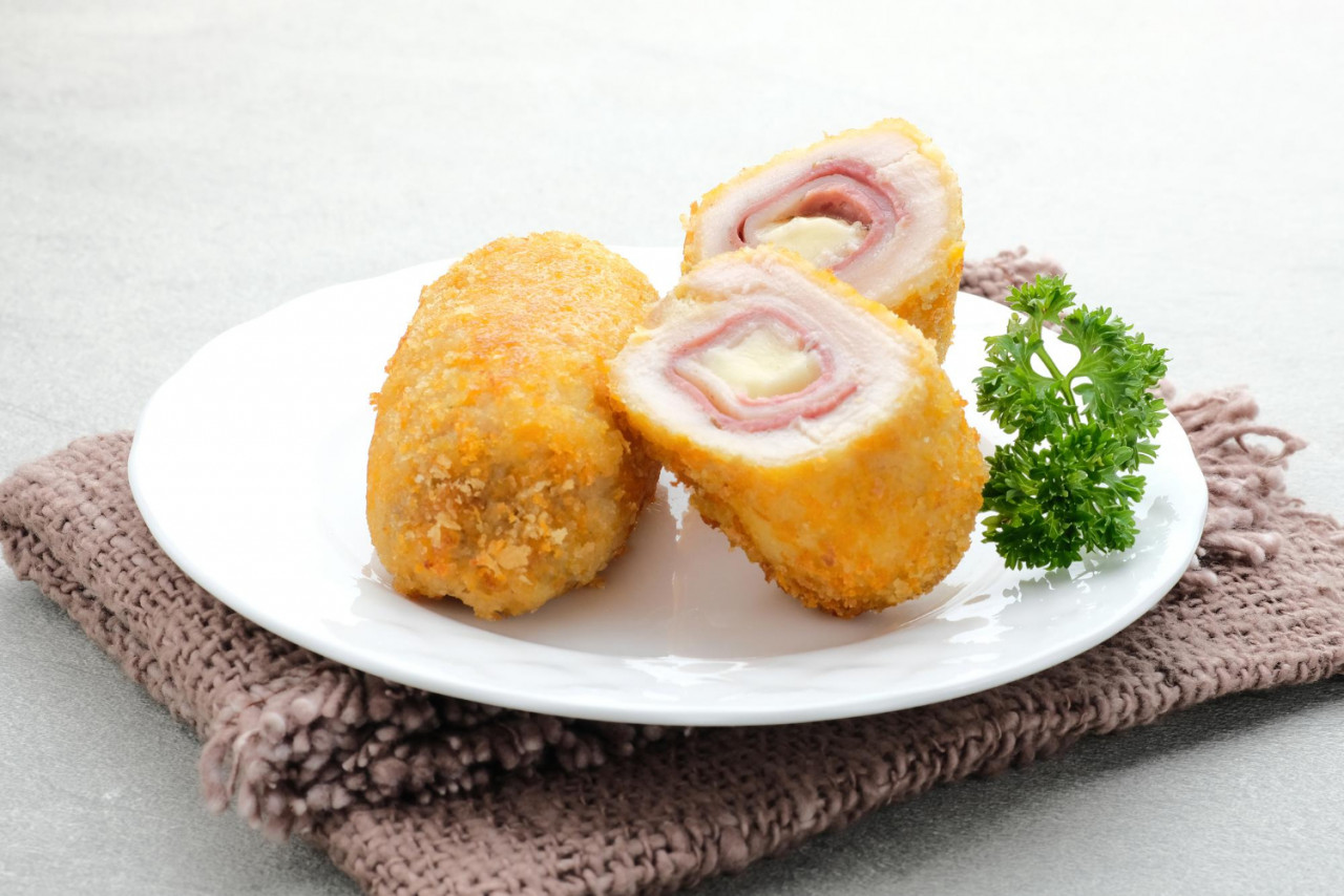 crispy cordon blue chicken fillet roll with ham cheese served plate grey background