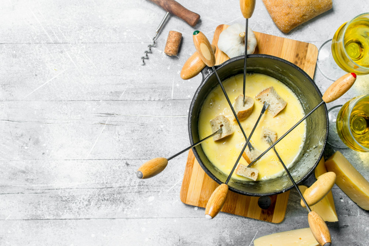 delicious fondue cheese with bread white wine rustic background 1